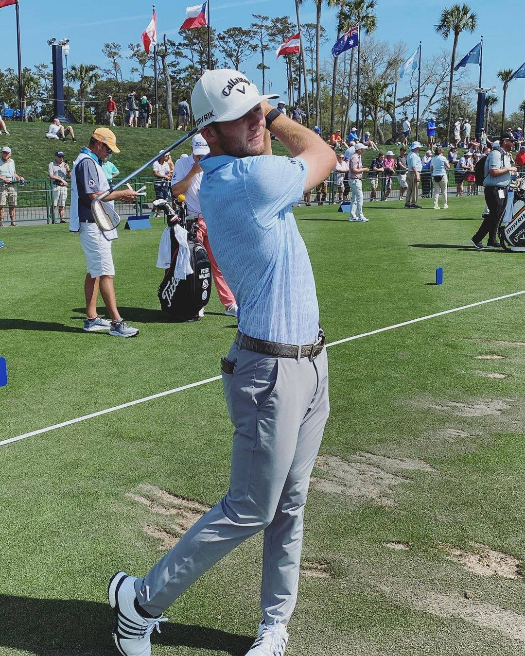 Sam Burns Demonstrating His Excellent Golf Swing On The Court Wallpaper