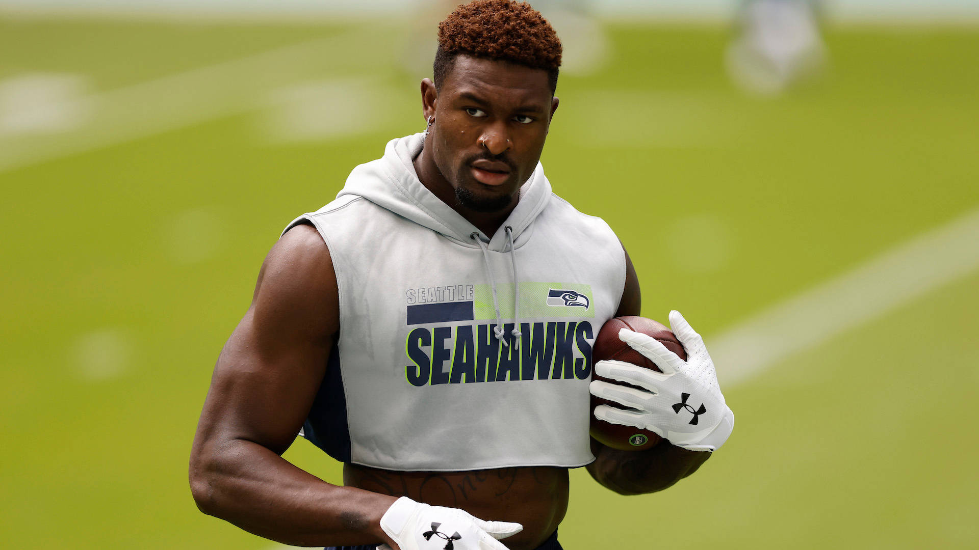 Seattle Seahawks’ Star Dk Metcalf In Casual White Attire Wallpaper