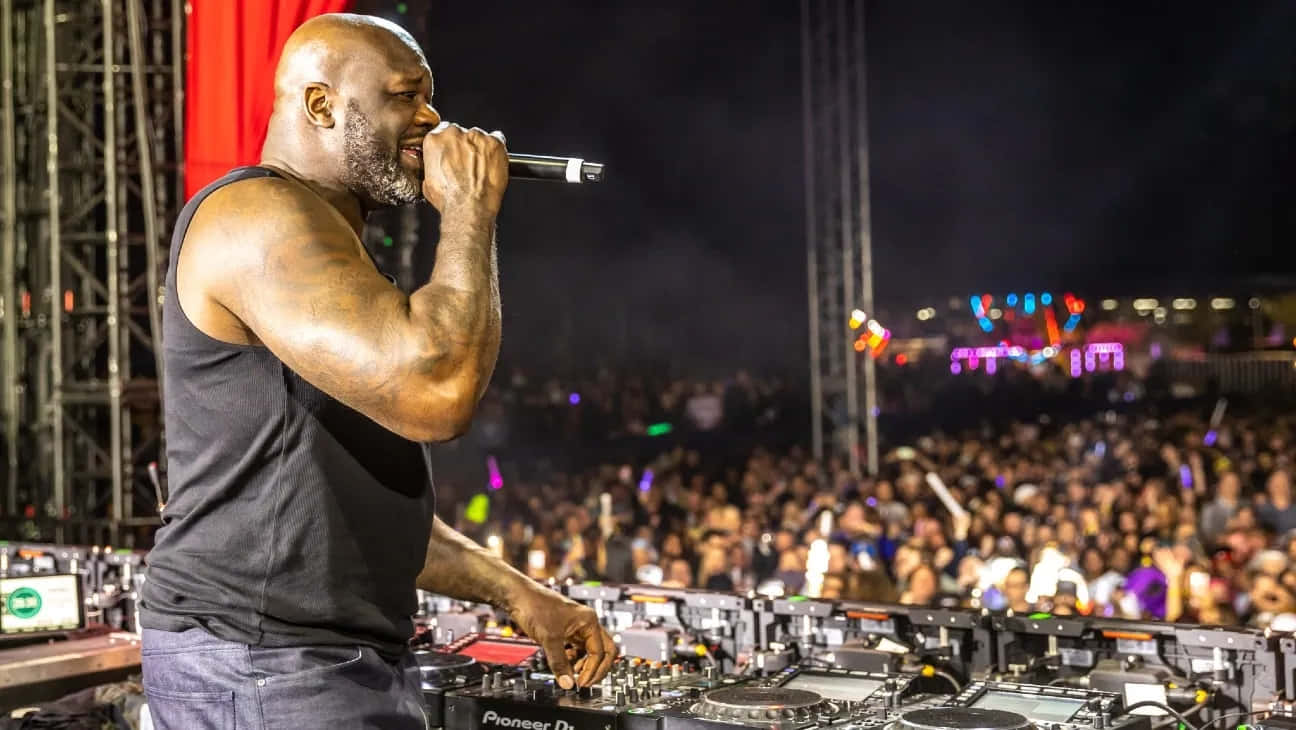 Shaq_ Performing_ D J_ Set_at_ Night Wallpaper