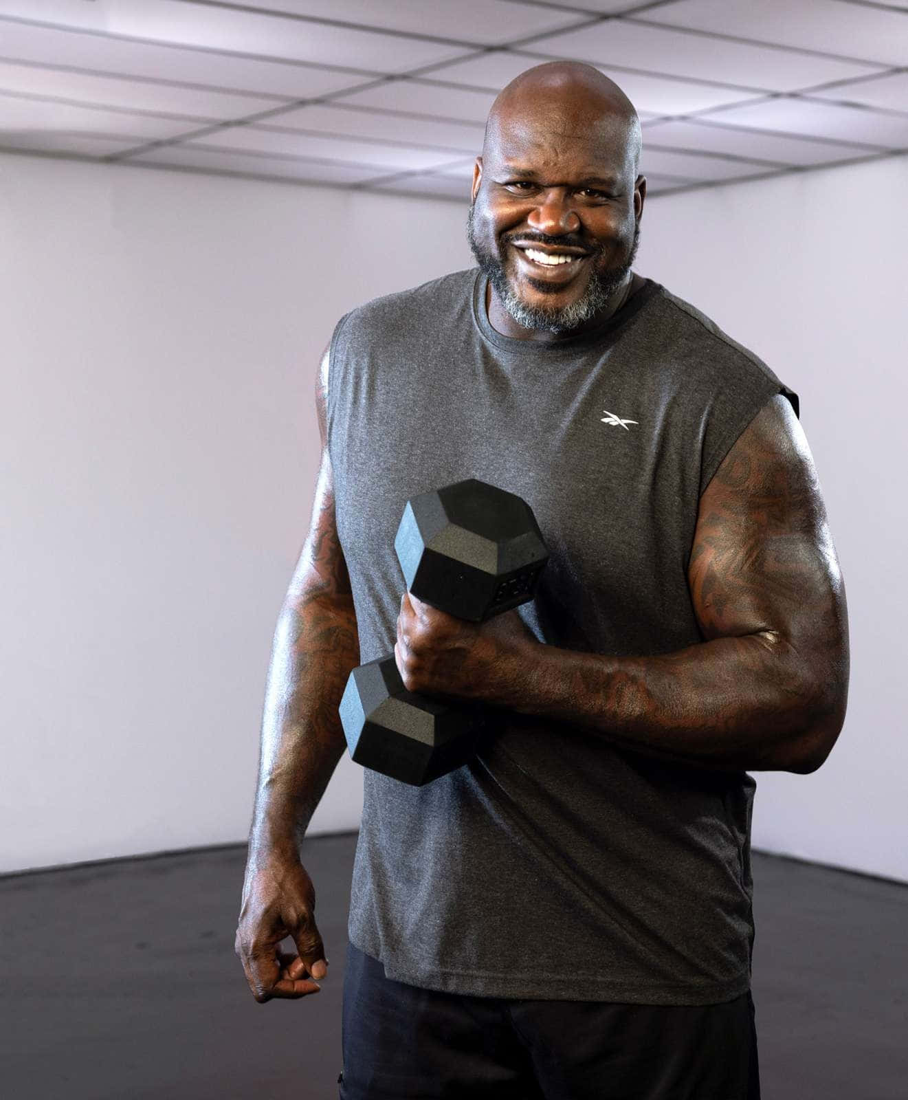 Shaq Working Out With Dumbbell Wallpaper