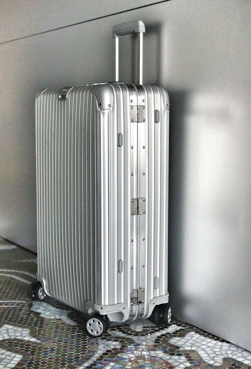 Silver Rimowa With Four Wheels Wallpaper