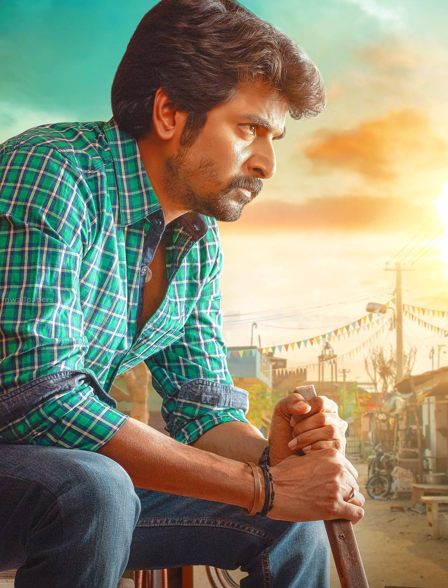 Sivakarthikeyan Sitting With Sunset Wallpaper