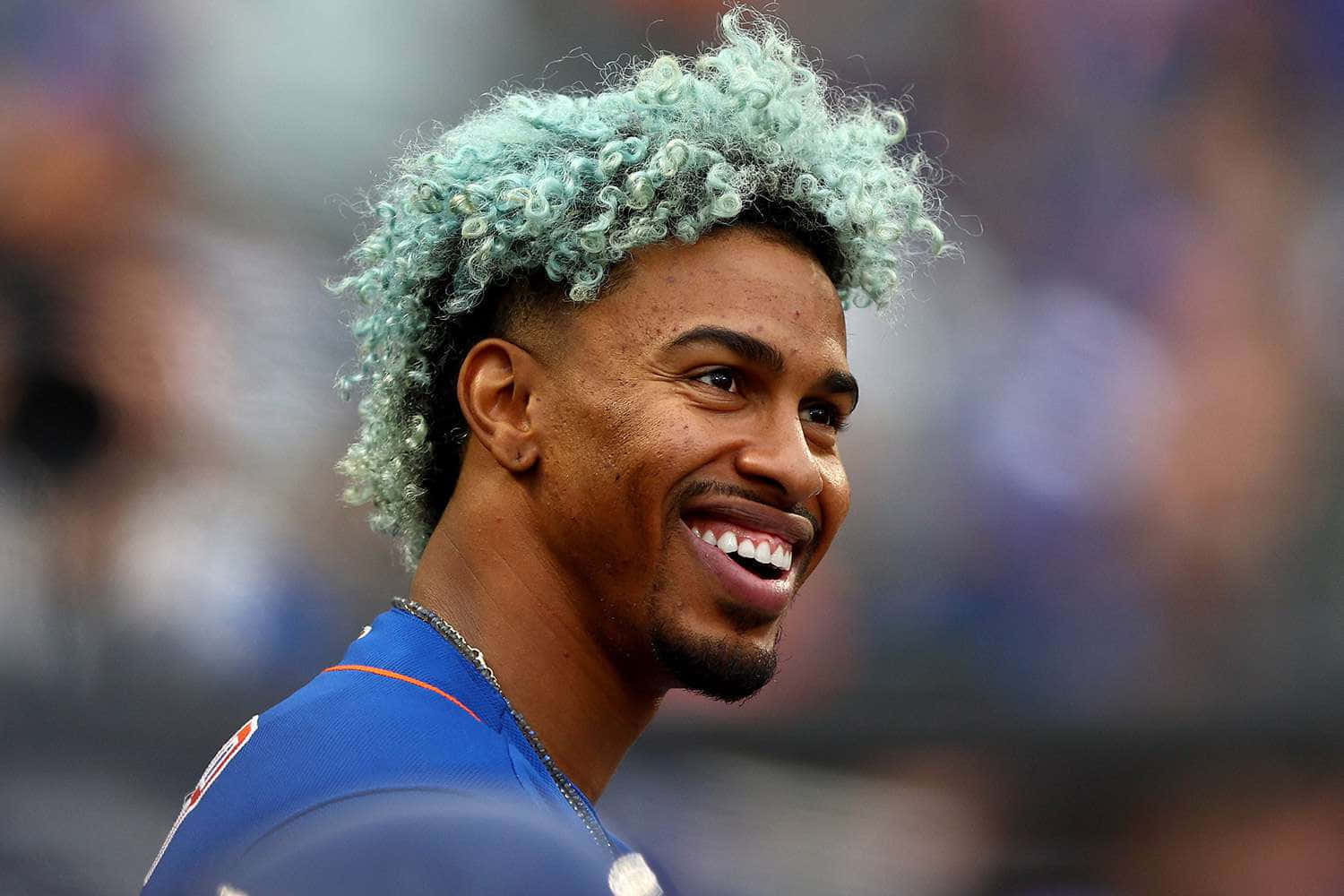 Smiling Baseball Playerwith Blue Hair Wallpaper