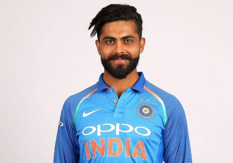 Smiling Ravindra Jadeja In Blue Unifrom Wallpaper