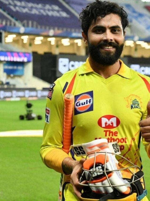 Smiling Ravindra Jadeja In Yellow Uniform Wallpaper