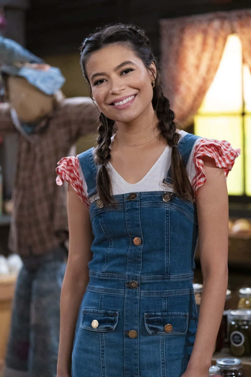 Smiling Young Womanin Denim Overalls Wallpaper