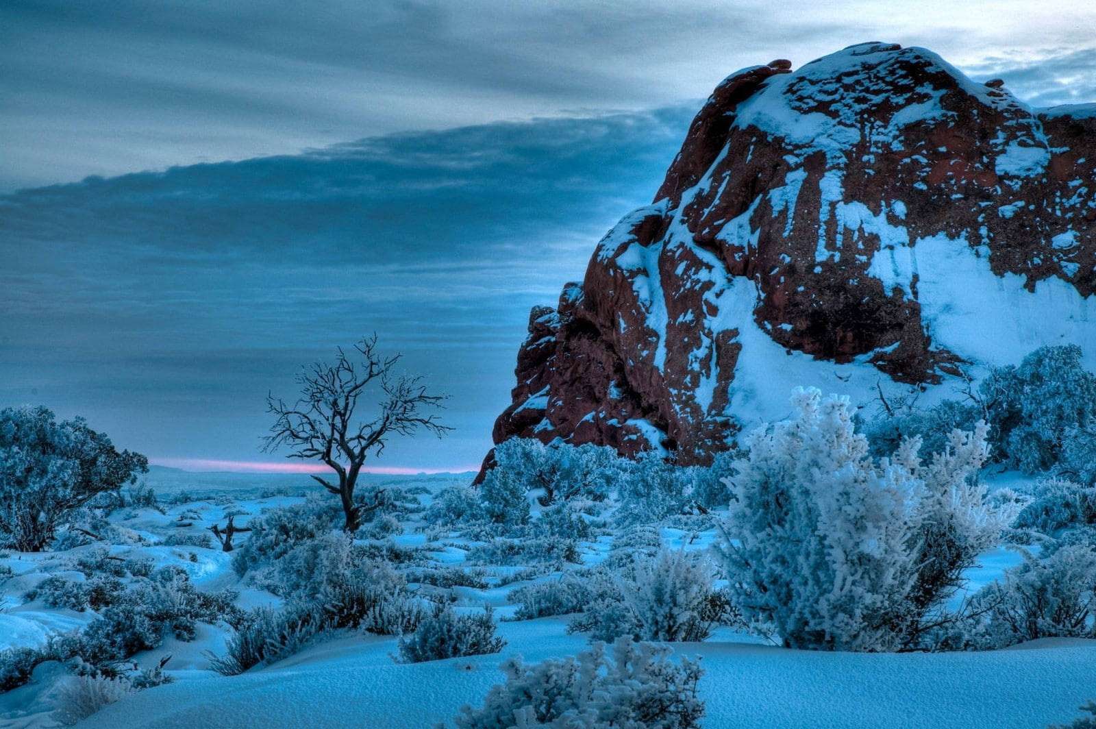 Snow-covered Rock At Arches National Park Wallpaper