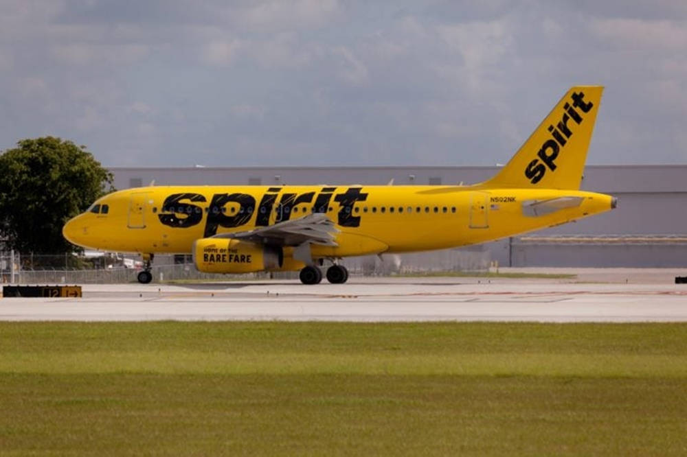 Spirit Airlines Plane On Green Grass Wallpaper