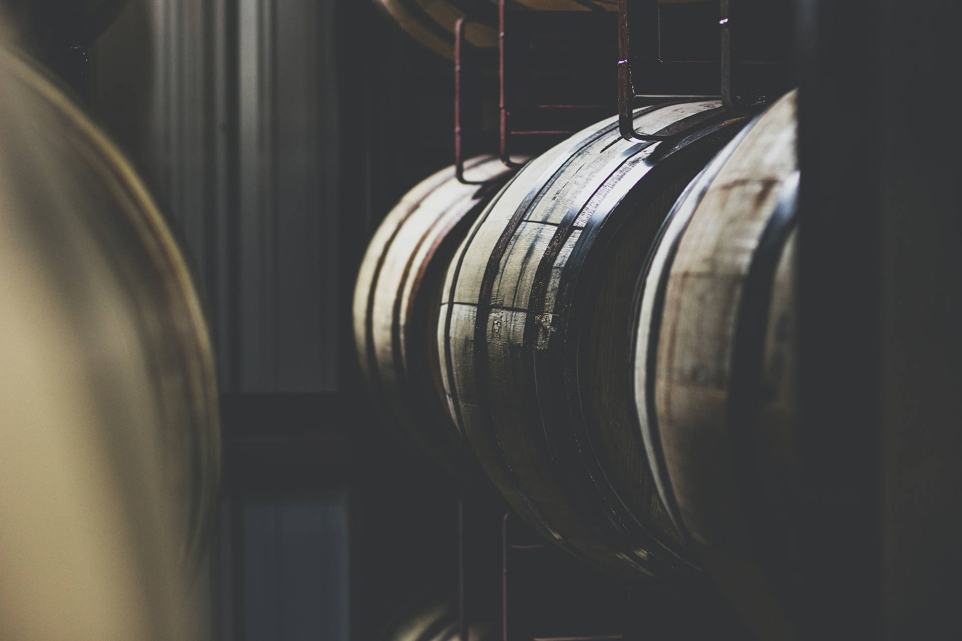 Stacking Up Excellence: Bourbon Barrels At Kentucky Peerless Distilling Co. Wallpaper