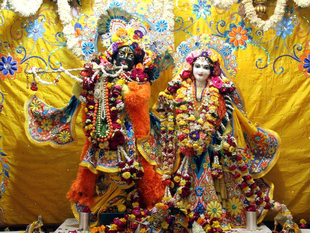 Statues Of Krishna And Radha In Iskcon Temple Wallpaper