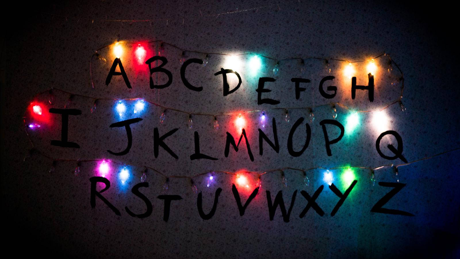 Stranger Things Alphabet With Lights Wallpaper