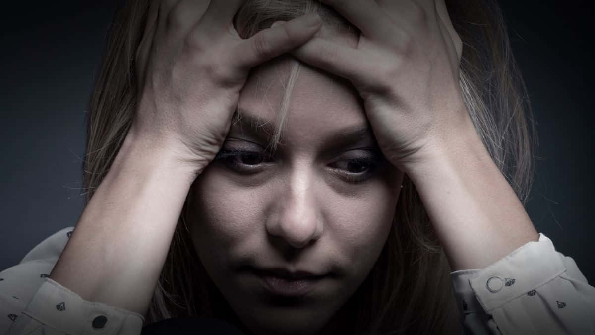 Struggling Woman Contemplating Late-term Abortion Wallpaper