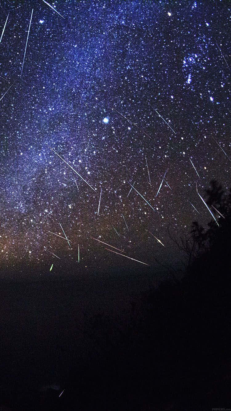 Stunning Meteor Shower In Night Sky Wallpaper