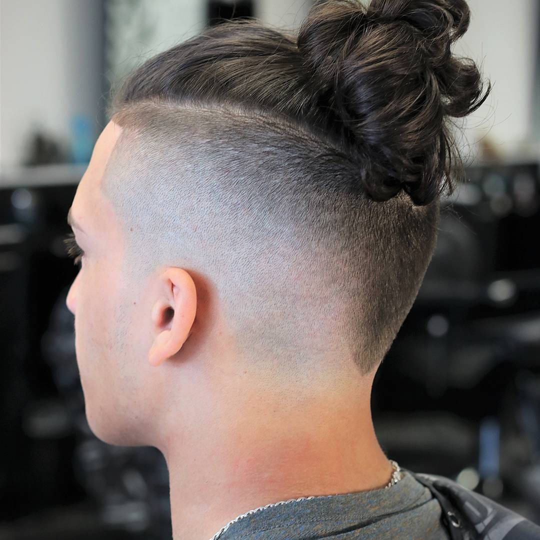 Stylish Undercut With Hair Bun For Men Wallpaper