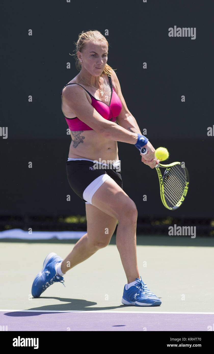 Svetlana Kuznetsova Delivering A Powerful Double-handed Stroke During A Tennis Match Wallpaper