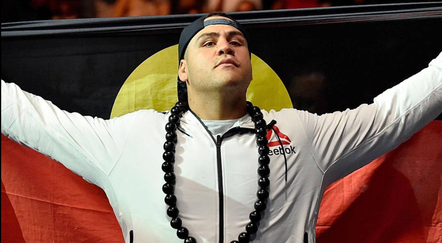 Tai Tuivasa Holding Flag From His Back Wallpaper