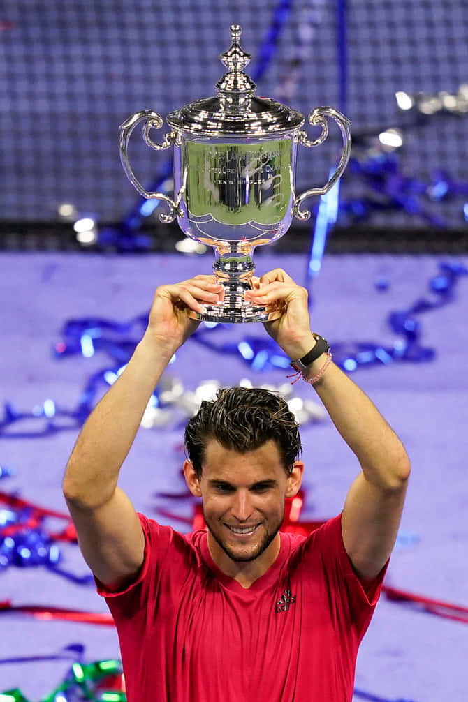 Tennis Champion Holding Trophy Wallpaper