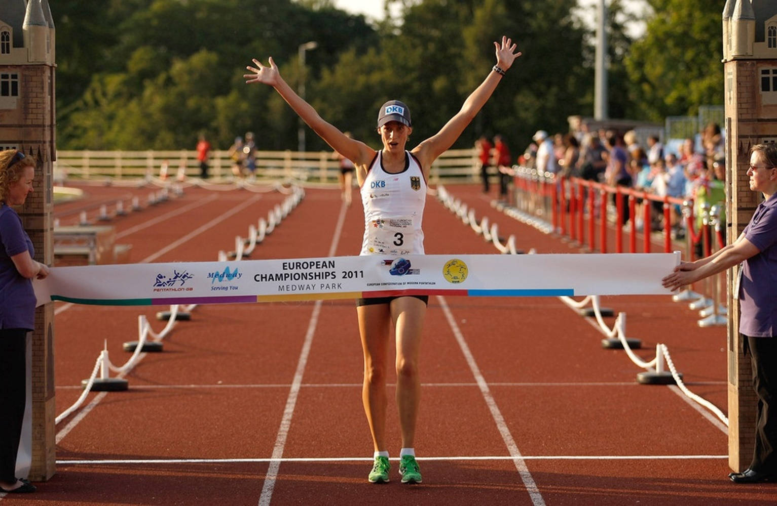 Thrilling Finish Line Snapshot From A Modern Pentathlon Event Wallpaper