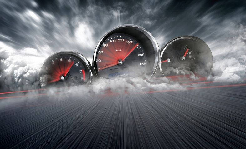 Thrilling Speedtest Depicting Internet Speedometer On The Road Wallpaper