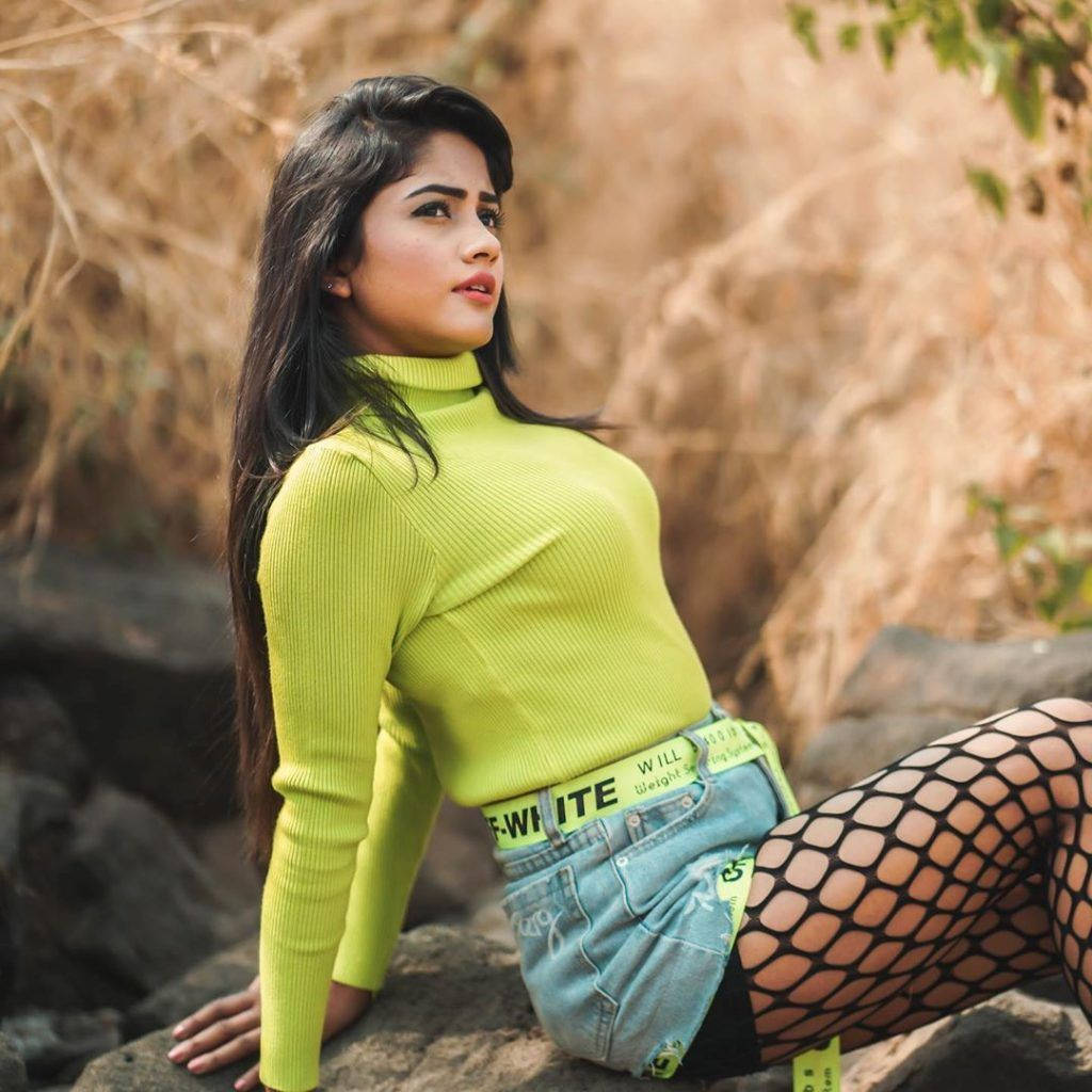 Tiktok Star Nisha Guragain Leaning Back Wallpaper