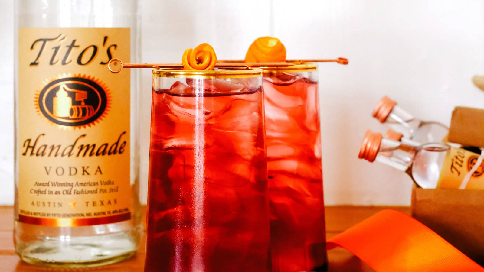 Toasting The Evening With Tito's Cranberry Cocktail Wallpaper