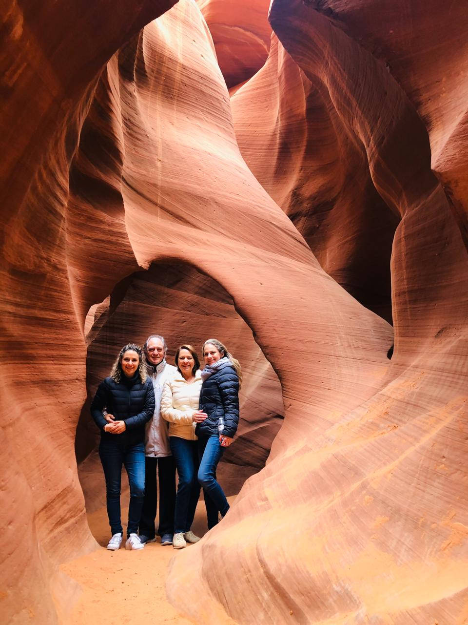 Tourists Exploring The Enchanting Antelope Canyon Wallpaper