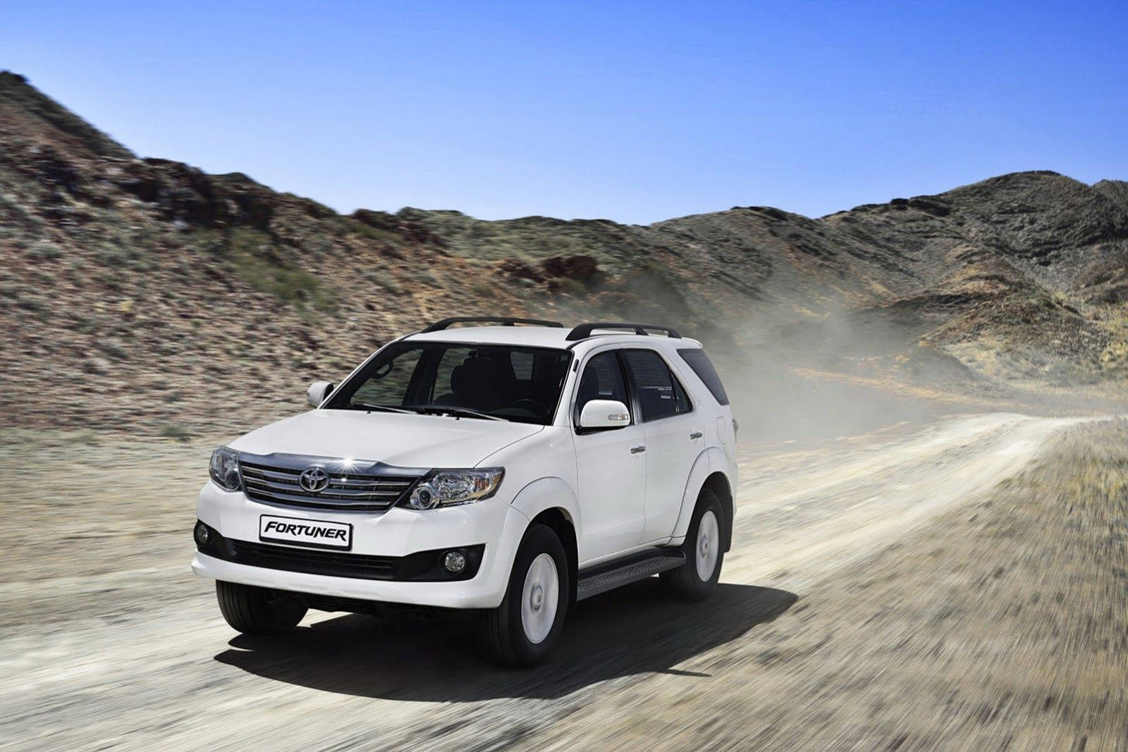 Toyota Fortuner White On Deserted Road Wallpaper