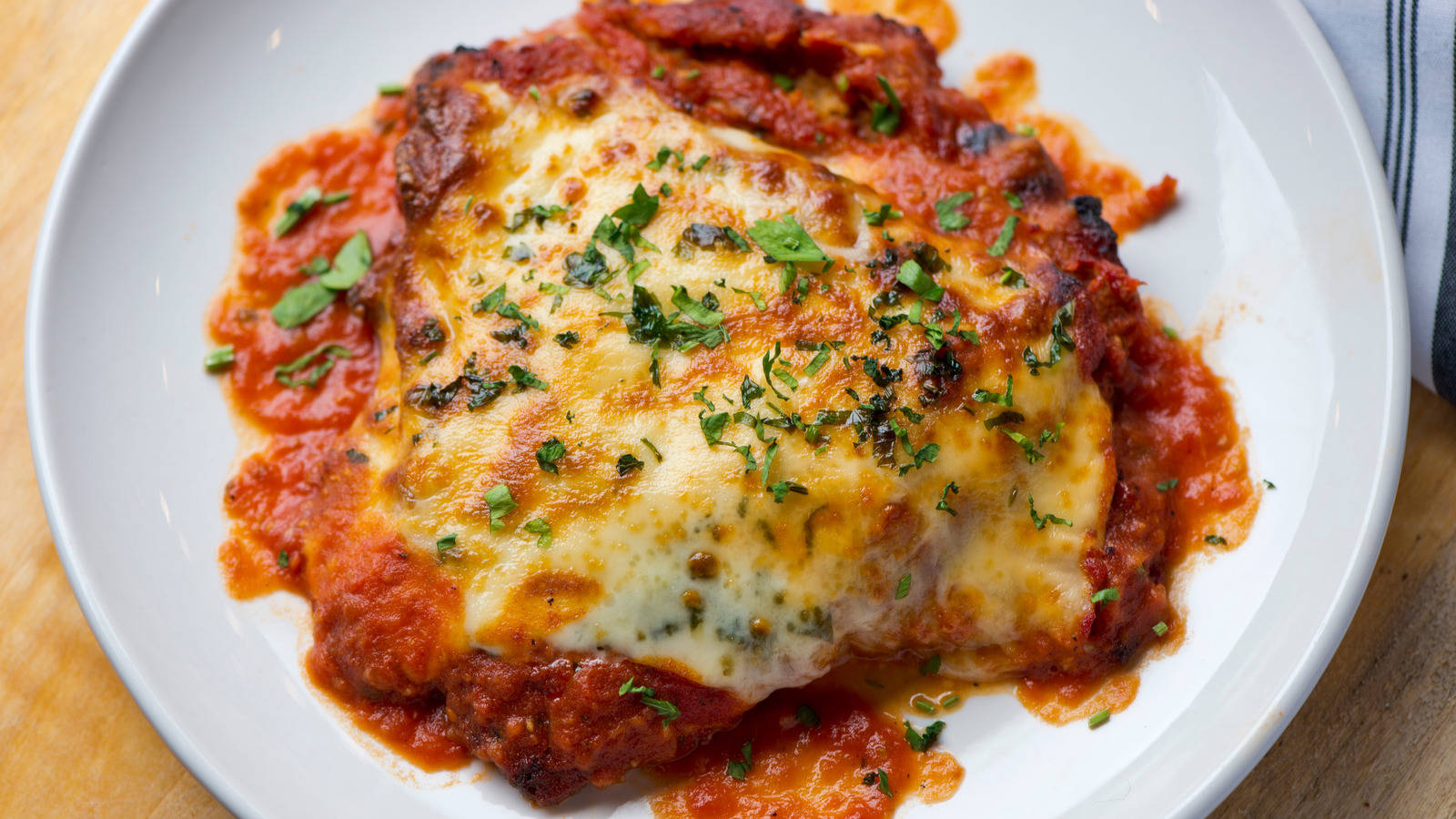 Traditional Chicken Parmigiana In Marinara Sauce Wallpaper