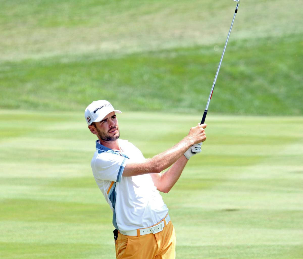 Troy Merritt Holding Golf Club Up Wallpaper