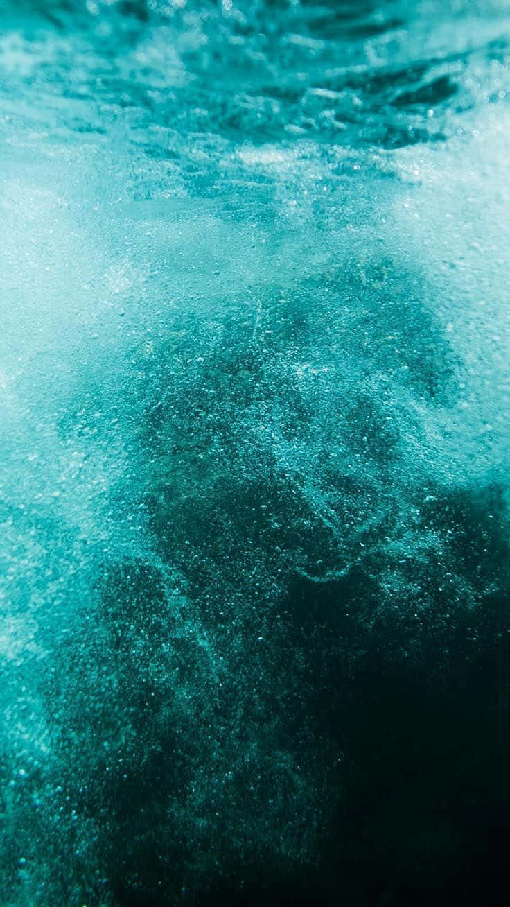 Underwater Water Surface With Green Water And Bubbles Wallpaper