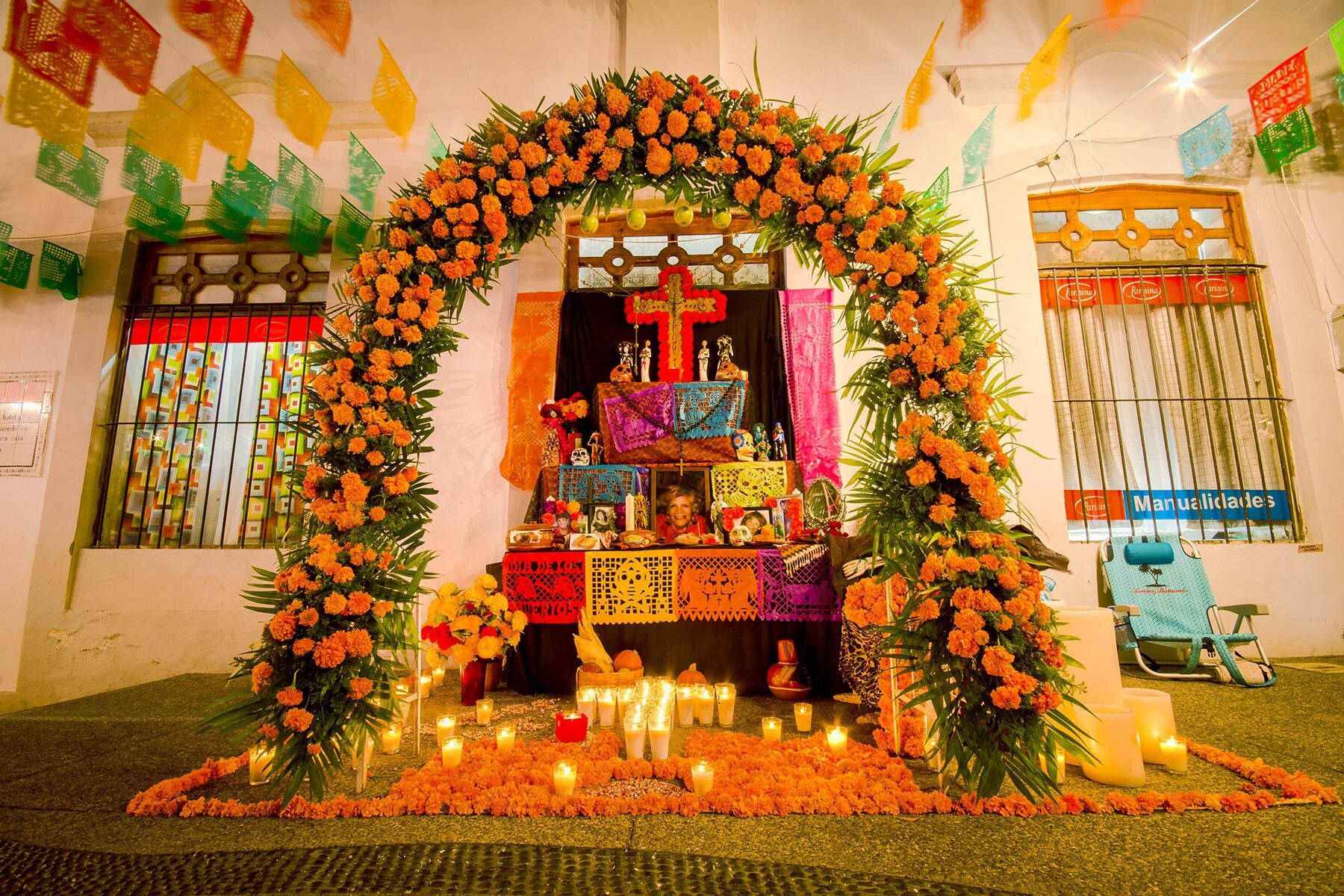 Vibrant Mexican Altar Adorned With Colorful Flowers Wallpaper