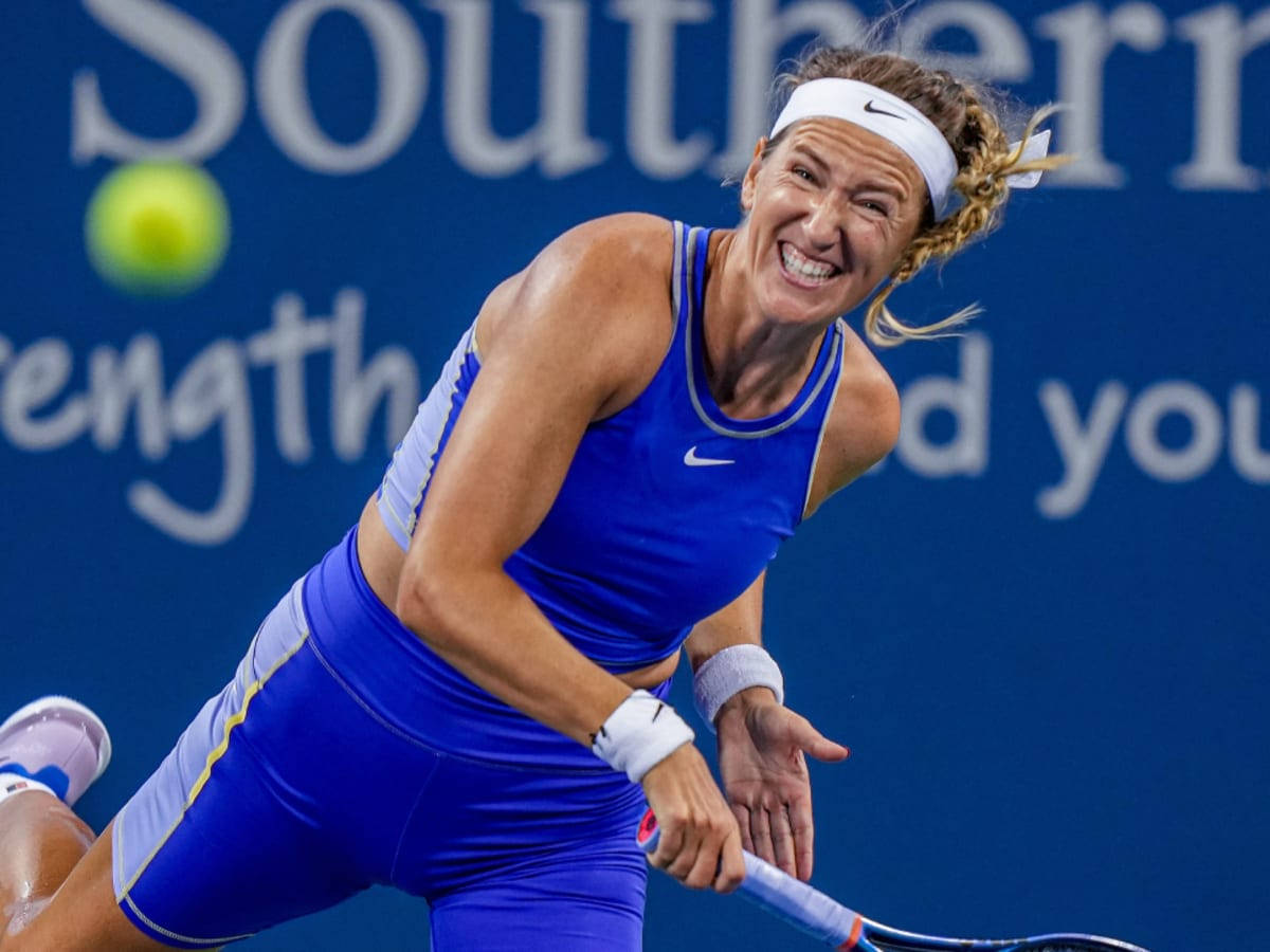 Victoria Azarenka In Blue Hitting Ball Wallpaper