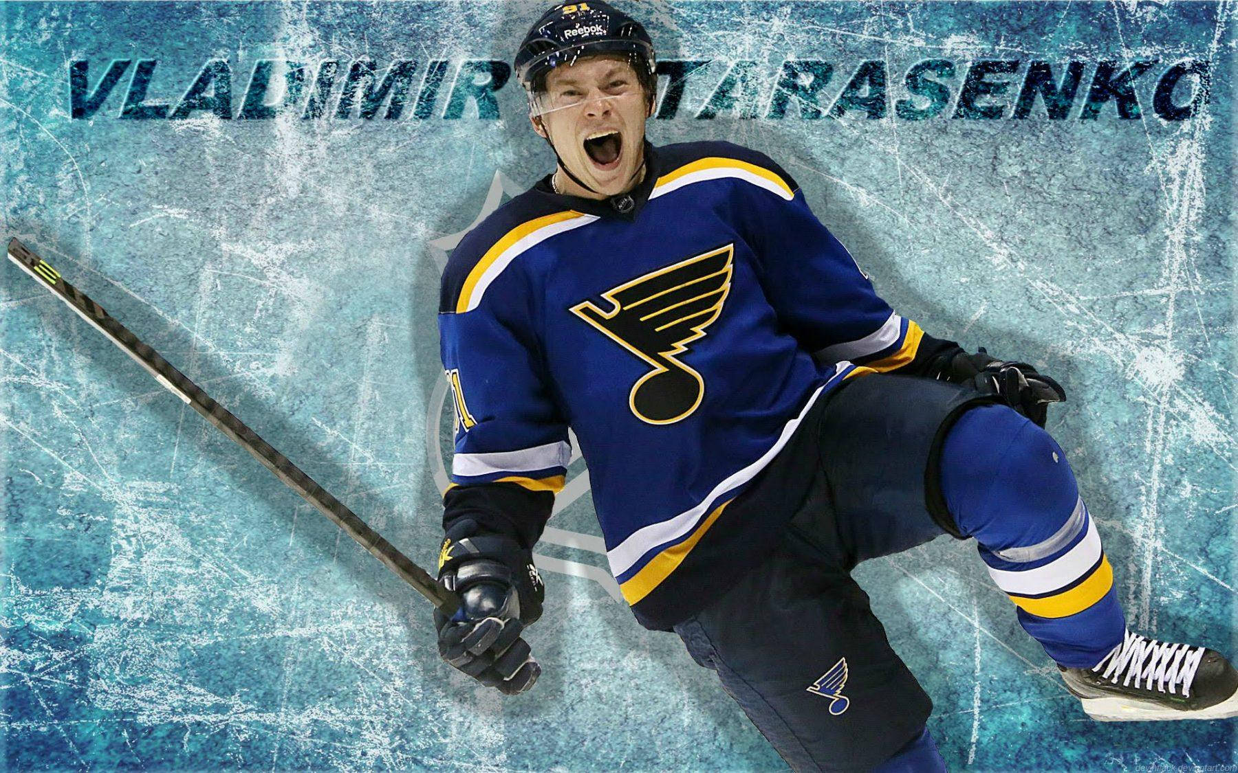 Vladimir Tarasenko Holding Hockey Stick With Shouting Expression And Name Wallpaper