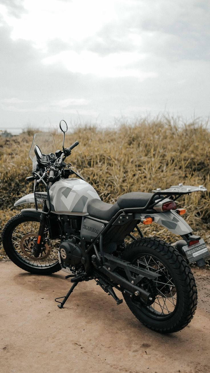 White Himalayan Bike Near Overgrown Field Wallpaper