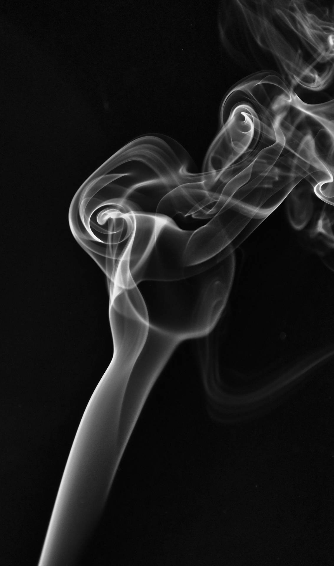 White Smoke Emanating From An Unknown Source In A Dark Environment. Wallpaper