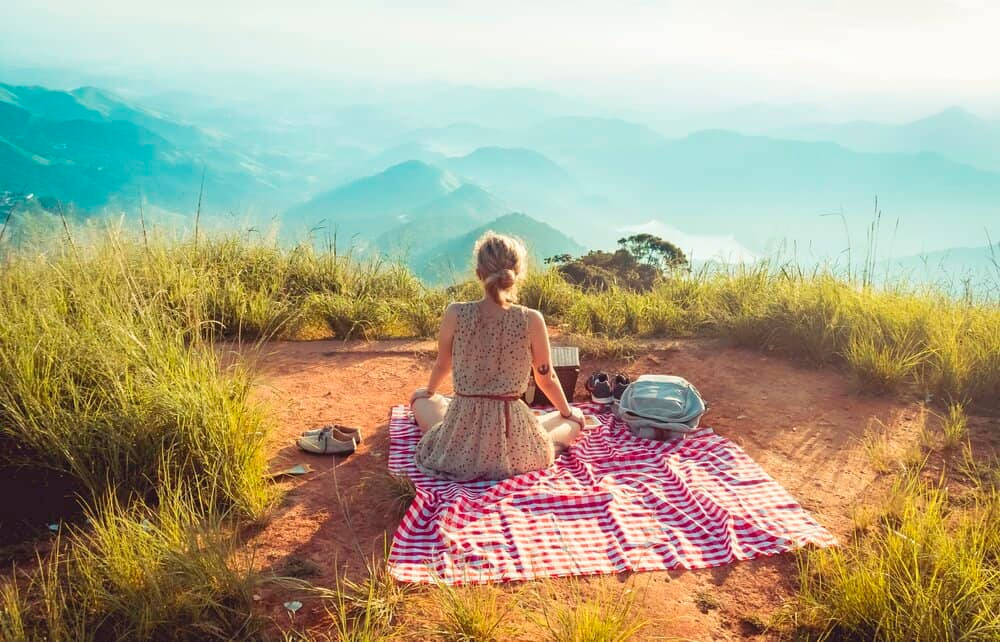 Woman Enjoying Life In The Mountains Wallpaper