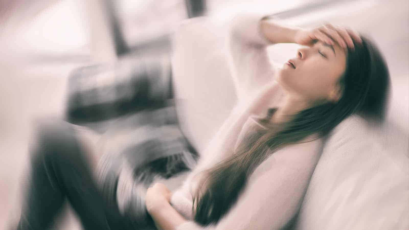 Woman Experiencing Fainting Episode Wallpaper