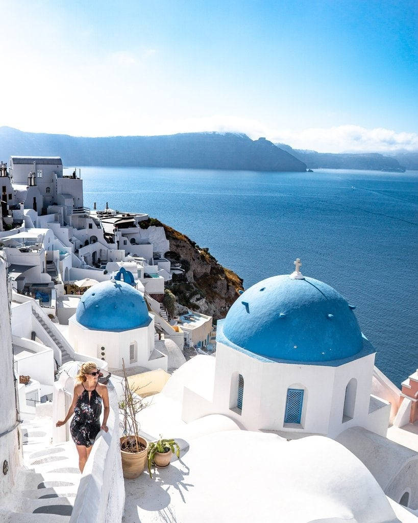 Woman Tourist In Santorini Wallpaper