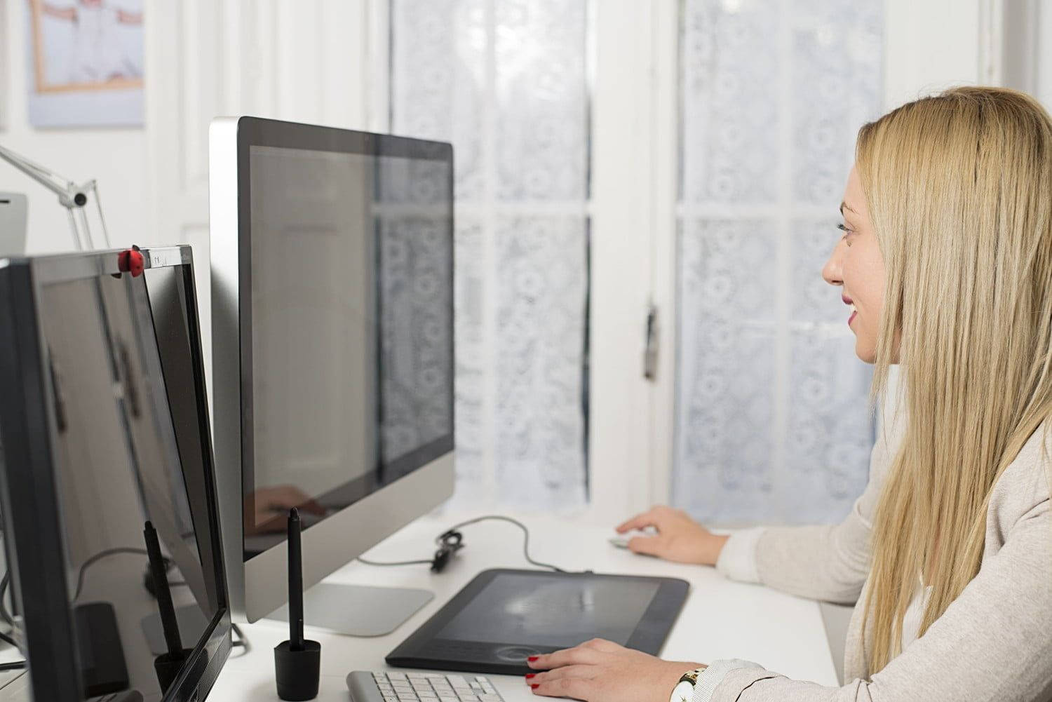 Woman Working On Marble Office Desk Wallpaper