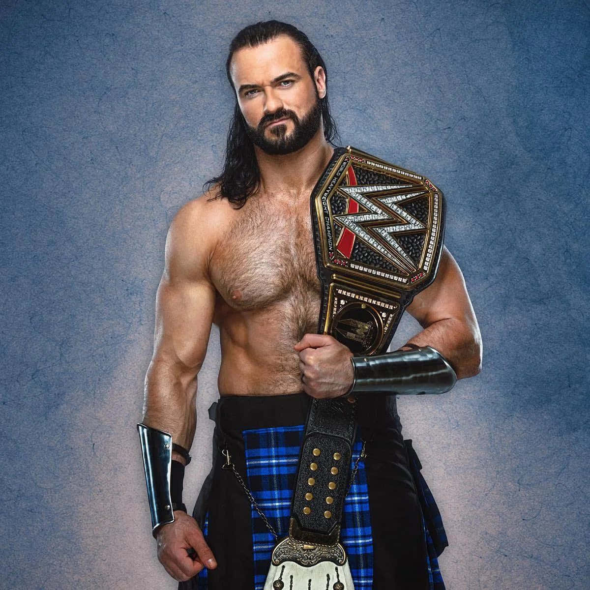 Wrestler Drew Mcintyre Celebrating Victory In Intercontinental Championship Wallpaper