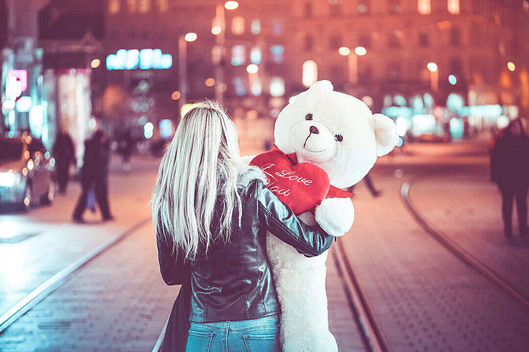 Young Woman With A Cute Teddy Bear Wallpaper