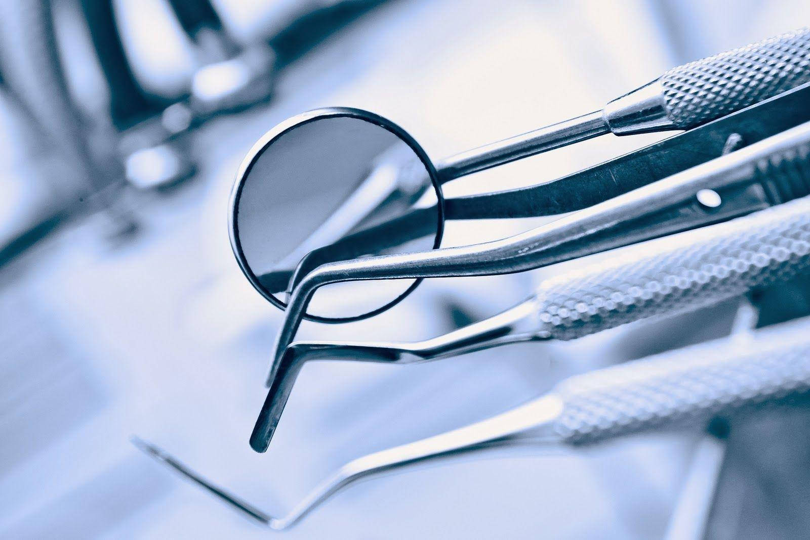 Zoomed In Dentist's Dental Tools Wallpaper