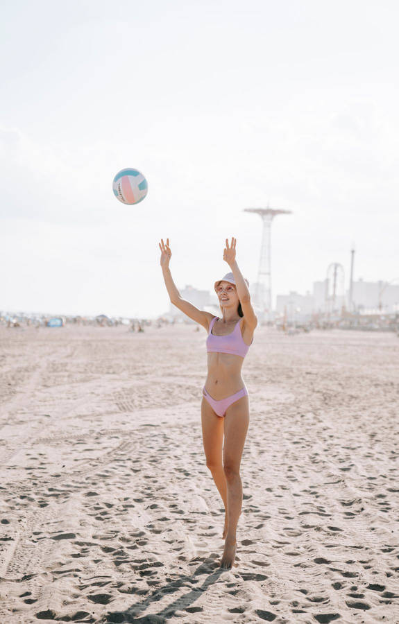 3 Talented Volleyball Players With A Passion For The Game Wallpaper