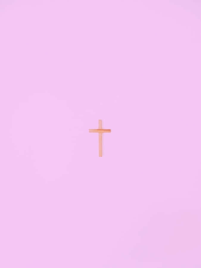 A Beautiful And Charming Cross With A Glowing Sun In The Background. Wallpaper