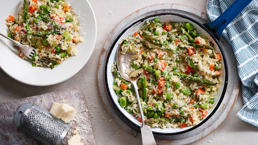 A Beautifully Presented Risotto With Fresh Greens. Wallpaper