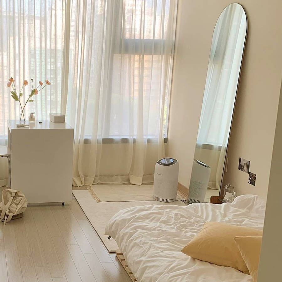 A Bedroom With A Bed, Mirror, And A Fan Wallpaper