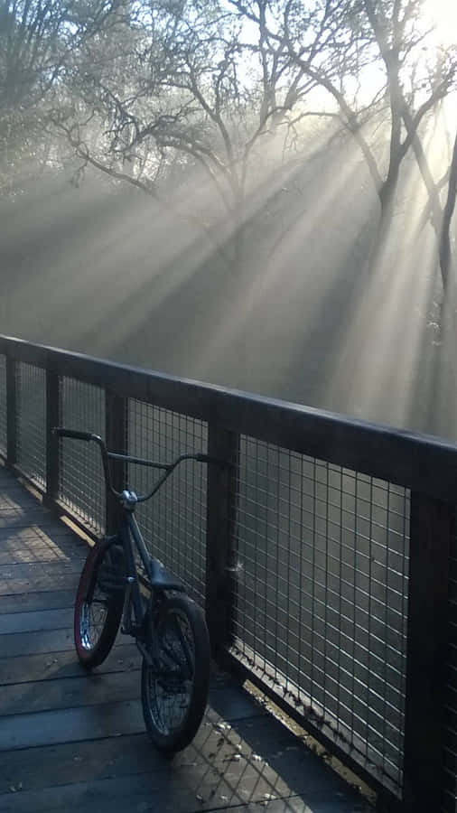 A Bike Parked On A Wooden Deck Wallpaper