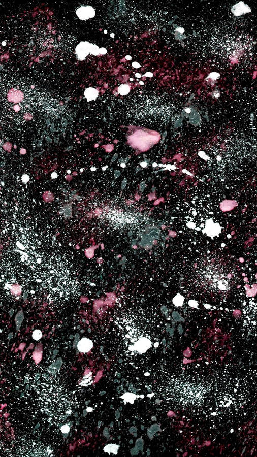 A Black And Pink Paint Splatter On A Black Background Wallpaper