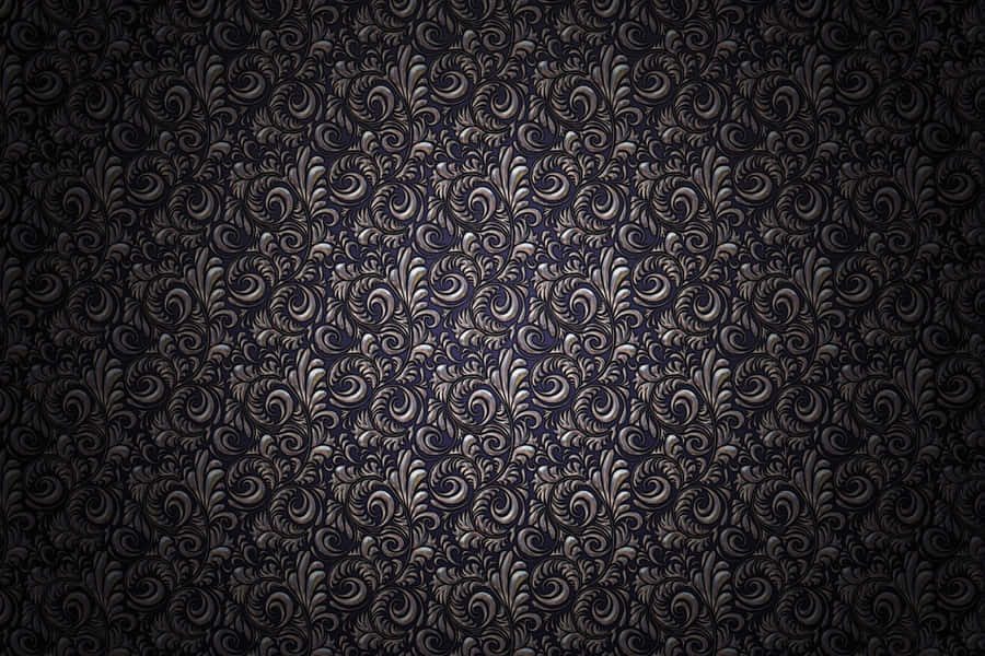 A Black And Silver Wallpaper With Swirls Wallpaper