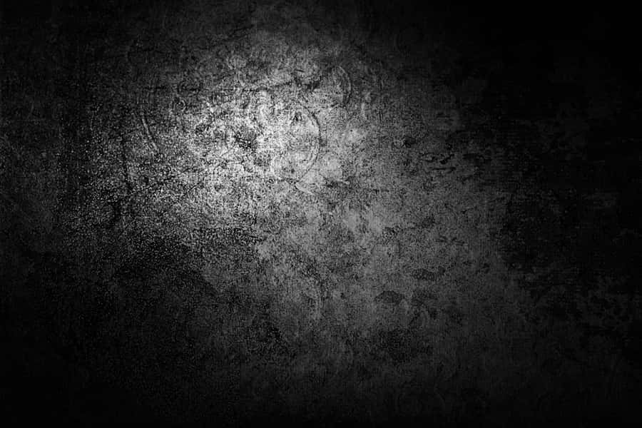 A Black And White Background With A Light Shining On It Wallpaper
